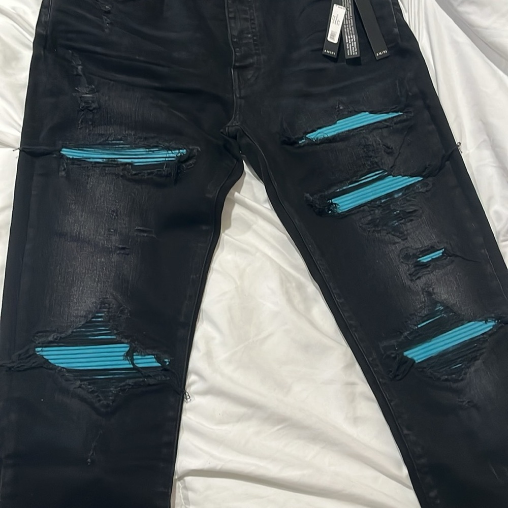 AMIRI Black Skinny Jeans with Distressed Blue Accents